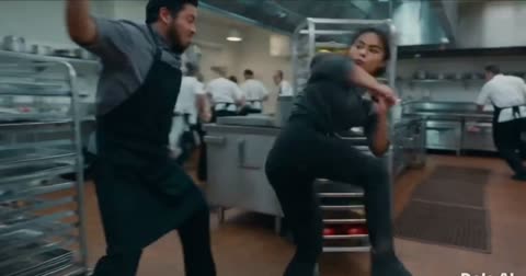 Woman fights three men in a restaurant kitchen